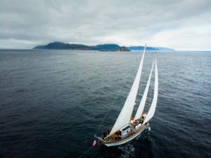 sailing-cape-st-james-haida-gwaii-aerial-passing-cloud