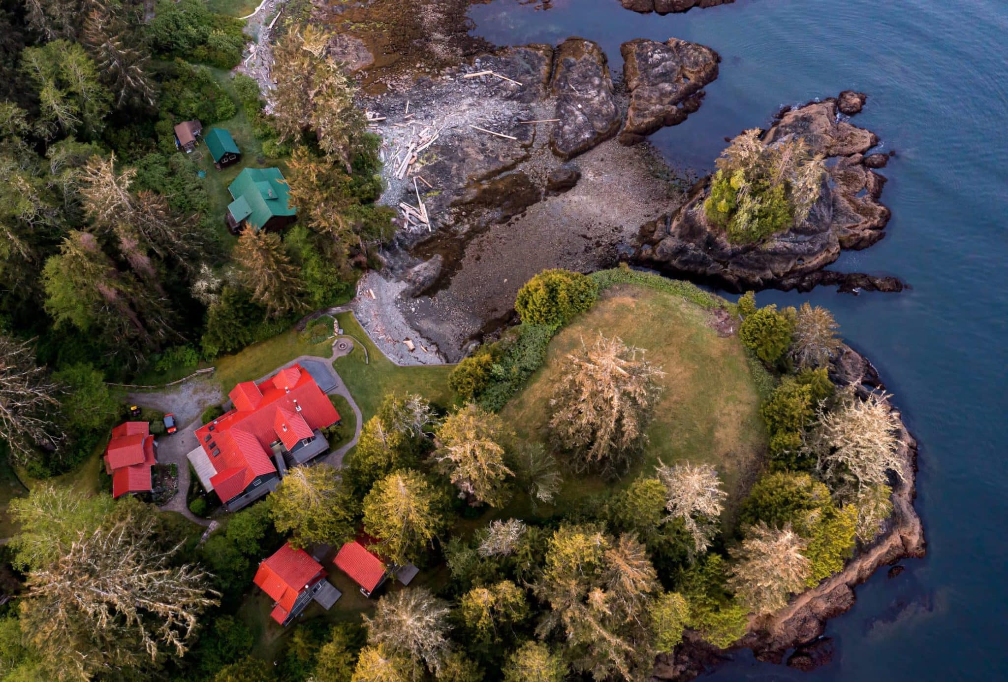 drone-image-showing-outer-shores-lodge-forests-beaches-buildings